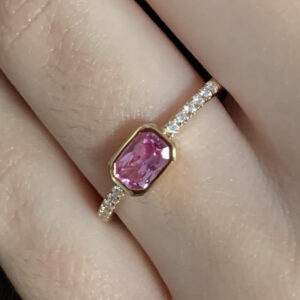 Pink sapphire ring on hand