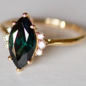 Teal peacock green marquise sapphire and diamond ring