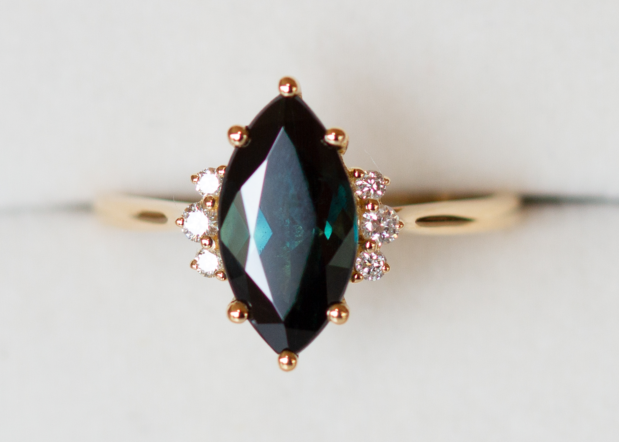 Teal peacock green marquise sapphire and diamond ring