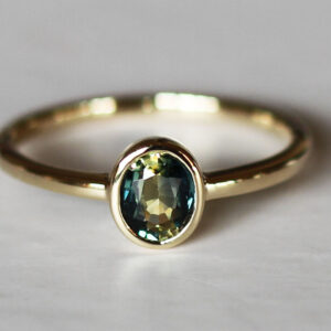 Oval teal petite sapphire gold ring