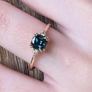 Teal cushion sapphire and diamond rose gold ring